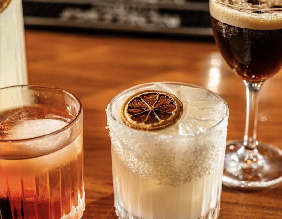 three drinks on a tan bartop